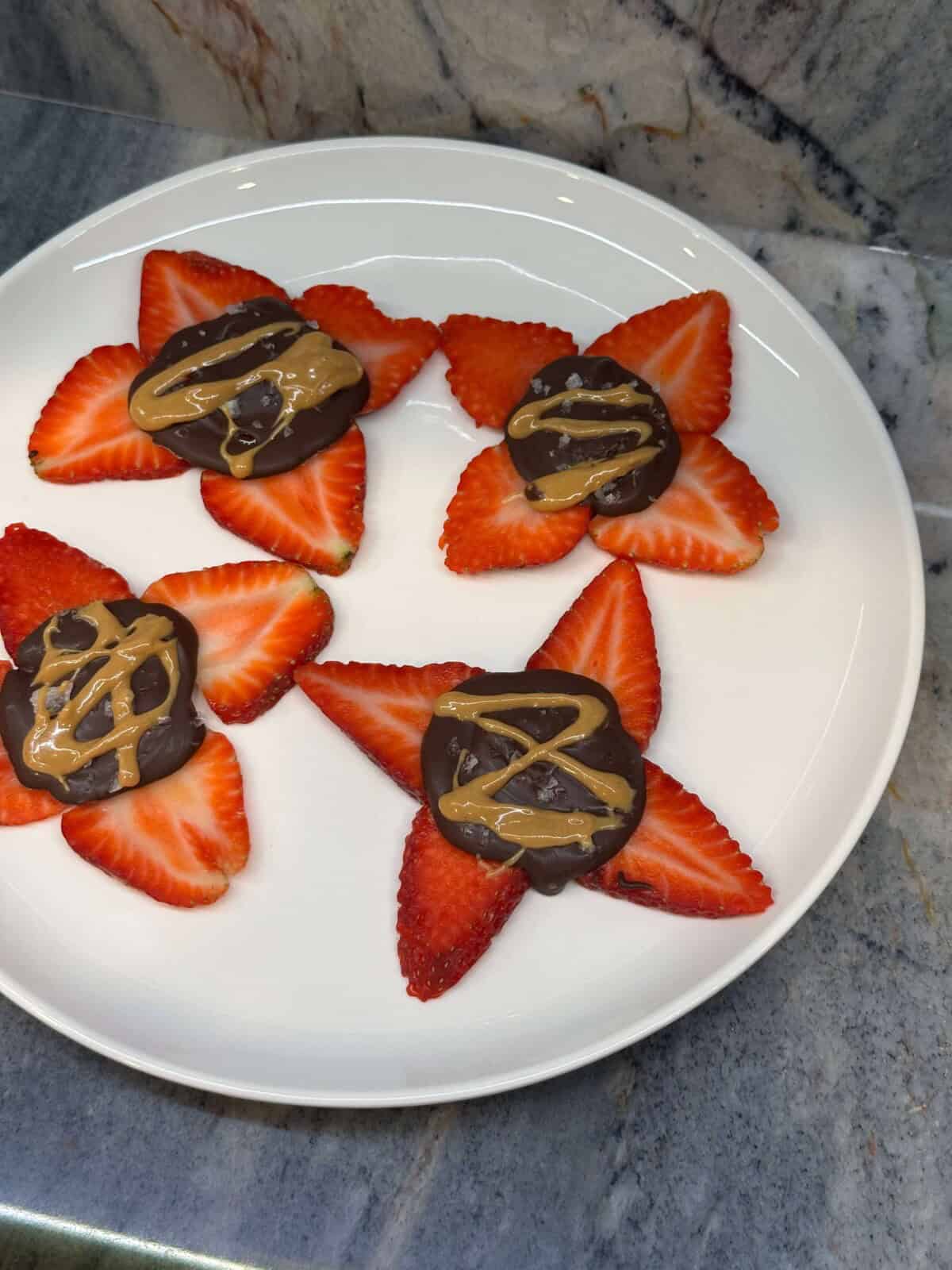 Plate of Strawberry Banana Bark on marble counter