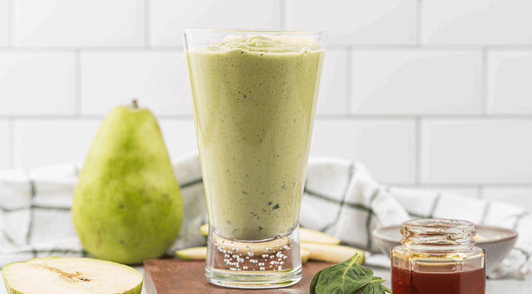 Green Pear Smoothie surrounded by green pear