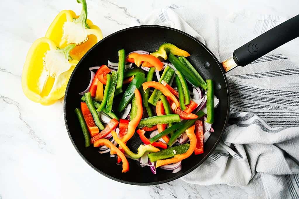 fajita mix in pan with different colors of bell pepper