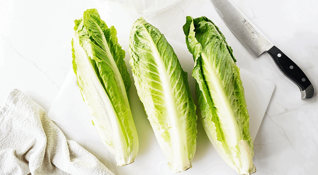 Romaine Lettuce on a cutting board with a knife