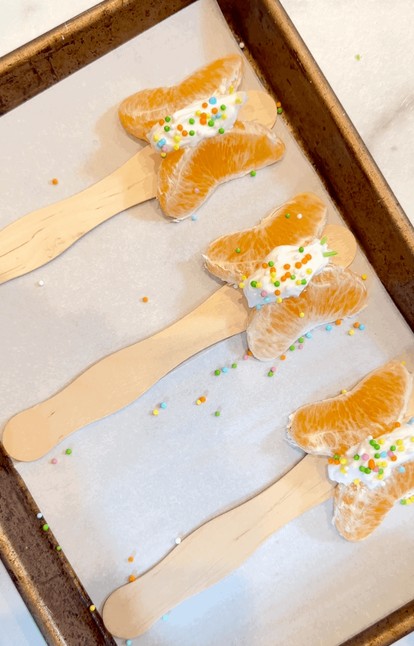 3 mandarin butterflys on sheet pan ready to freeze