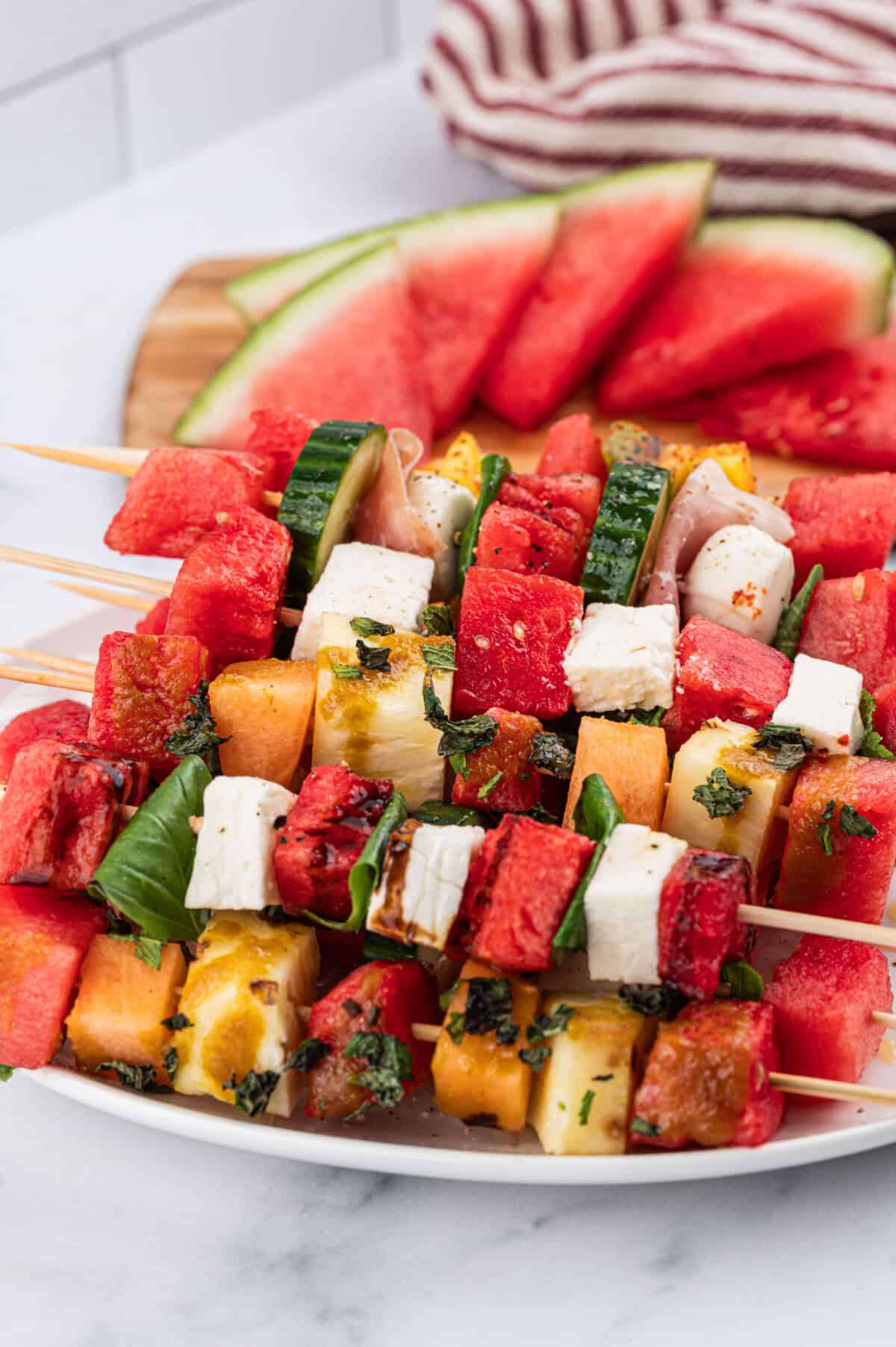 Vertical image of Watermelon skewers on a plate