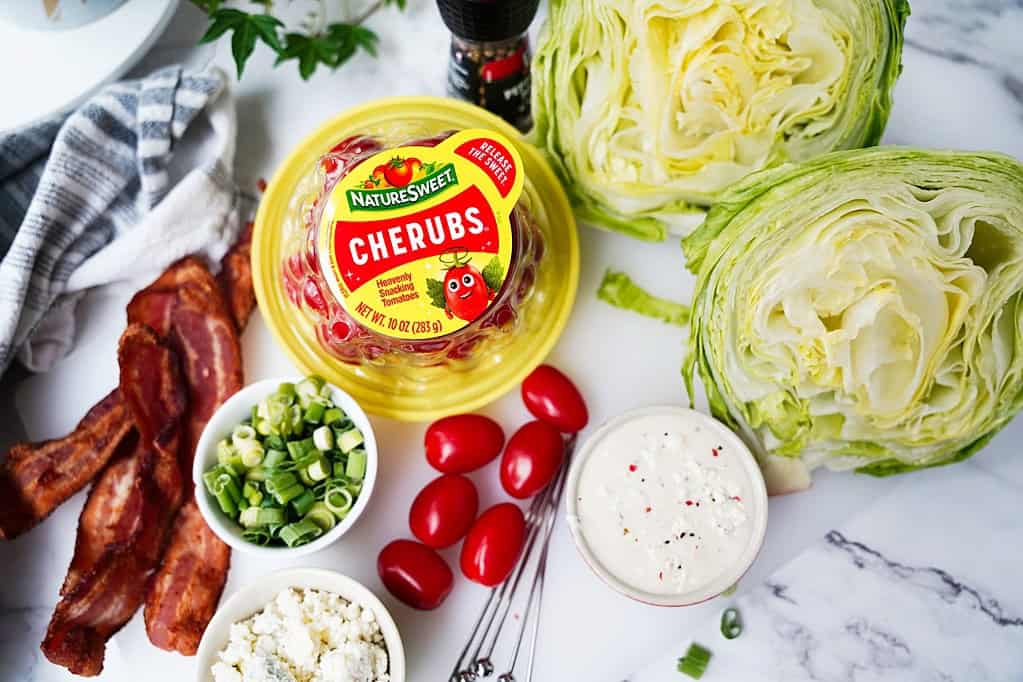 iceberg lettuce, tomatoes, bacon, blue cheese, blue cheese dressing, green onions
