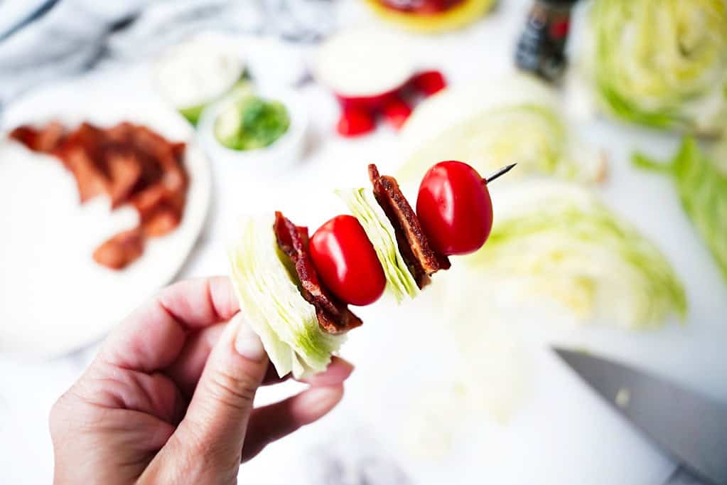 lettuce wedges, bacon, and tomato on a stick