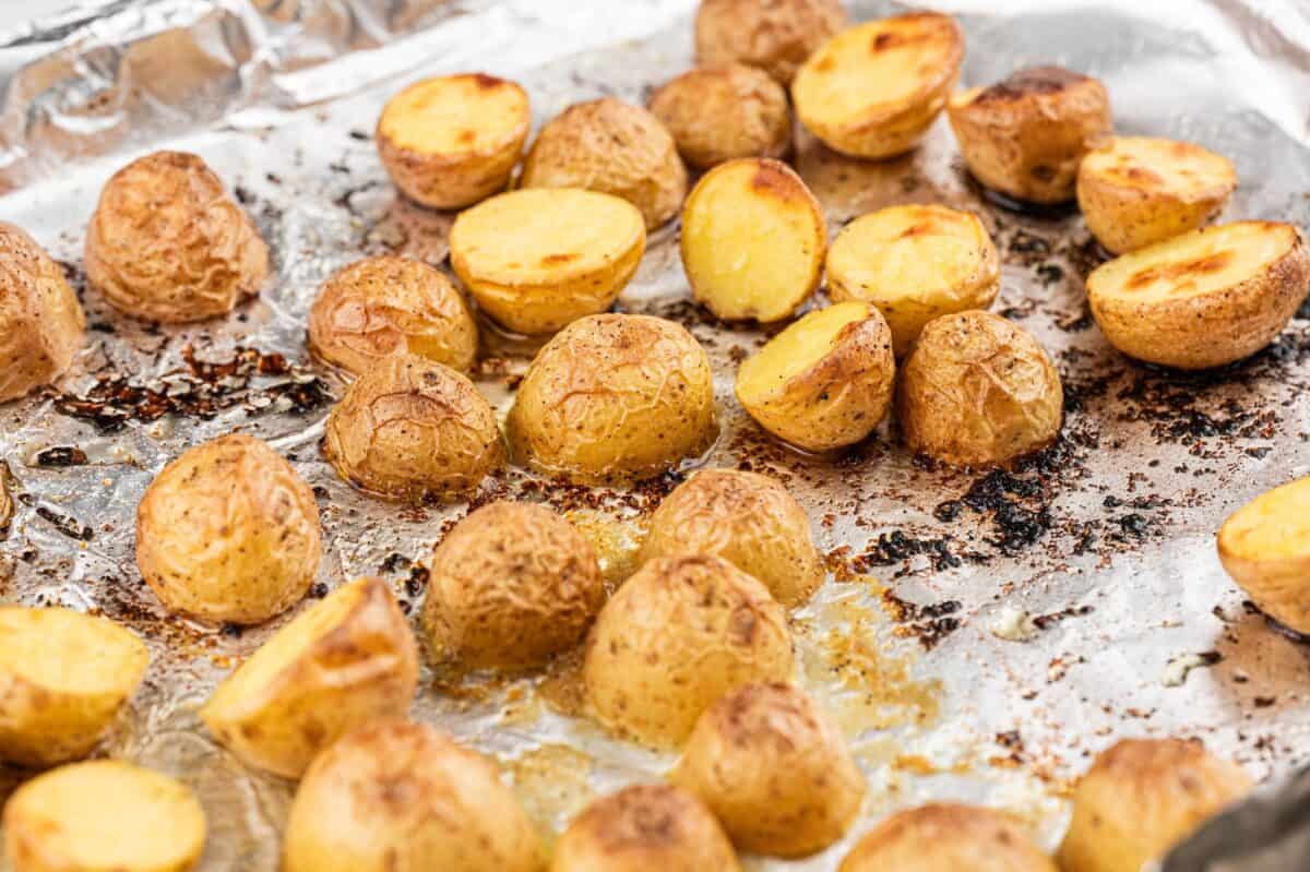 crispy roasted potatoes on a foil lined sheet pan