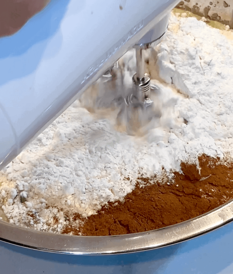 Mixing in dry ingredients for the blueberry zucchini bread