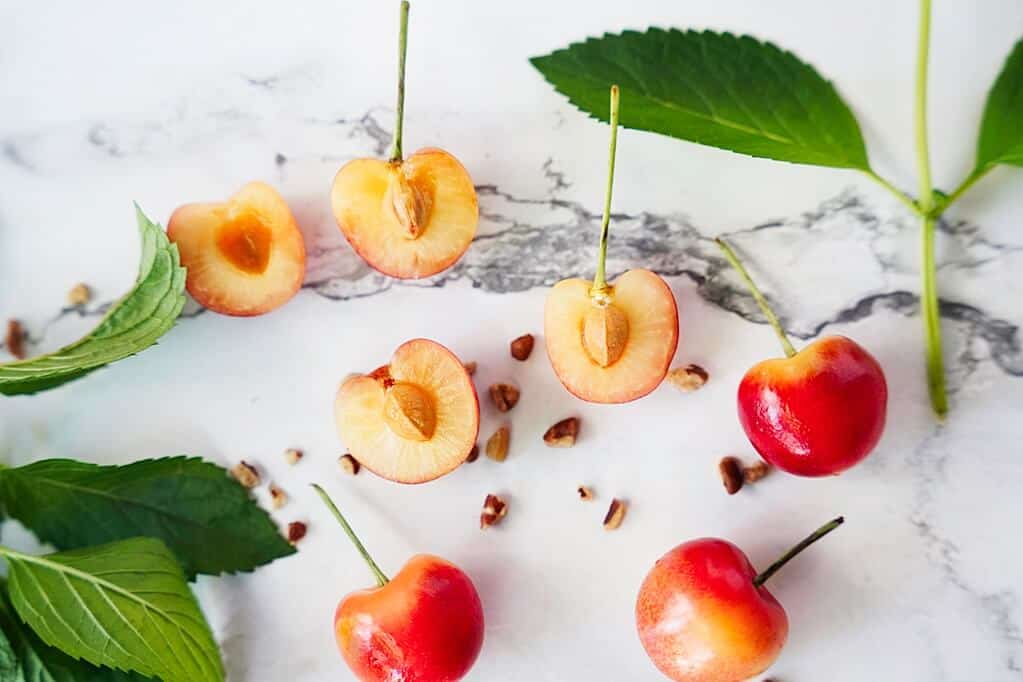 Rainier Cherries cut open on counter