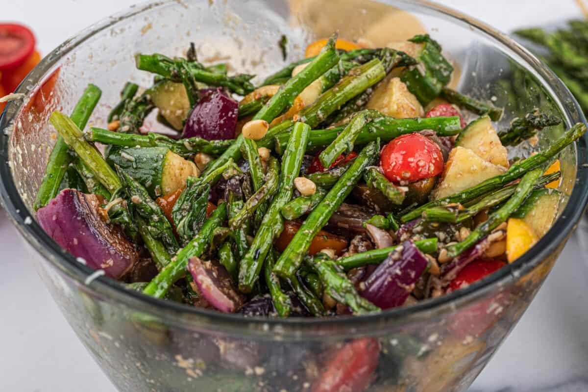 Grilled asparagus salad in a glass serving bowl