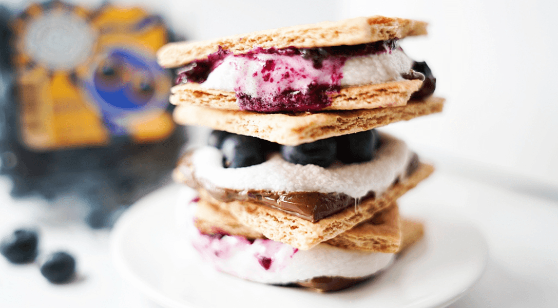 Stack of Blueberry S'mores showing 2 ways: fresh blueberries & blueberry sauce