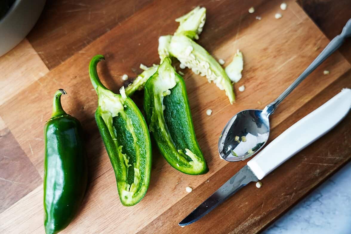 cut jalapeno on a wooden board