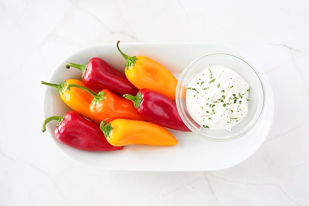plate of sweet mini peppers with a dip