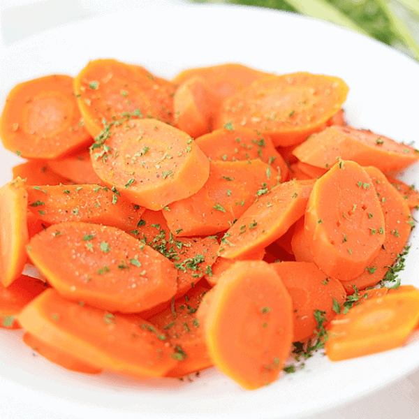Plated boiled carrots with seasoning