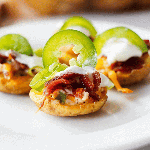 Jalapeno popper potato skins on white plate