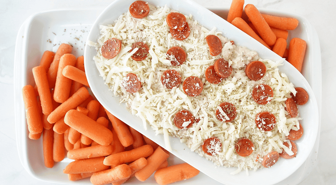 Overhead shot of the Ranch Pizza Dip on platter with carrots