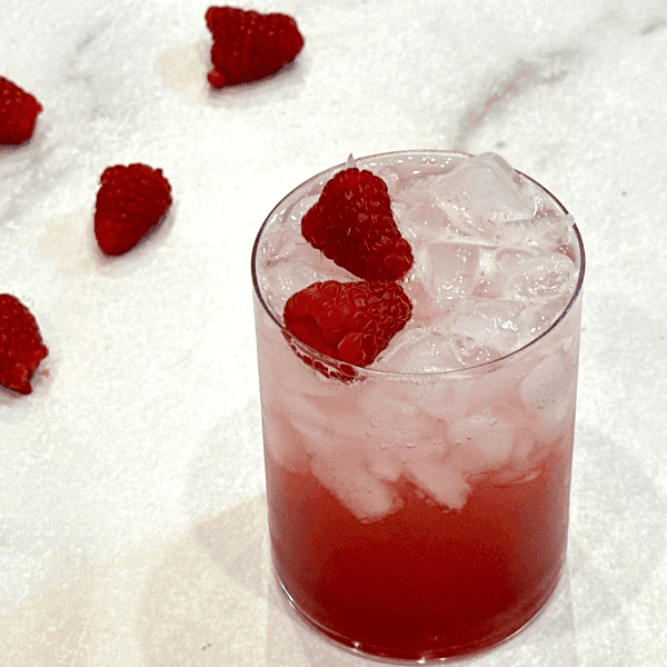 raspberry fruit soda on counter