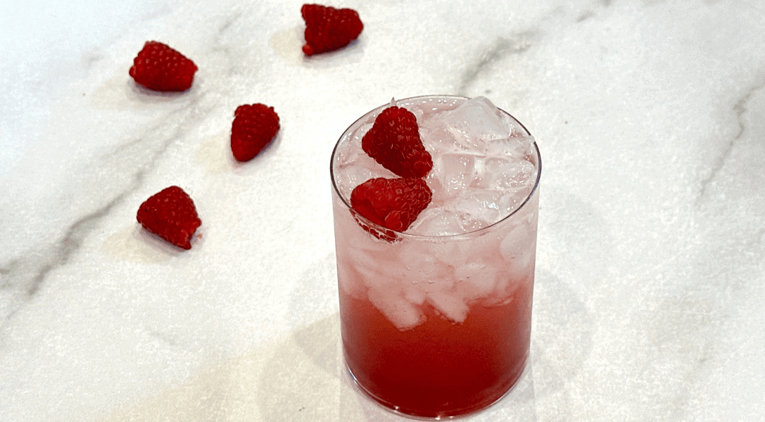 raspberry fruit soda on counter