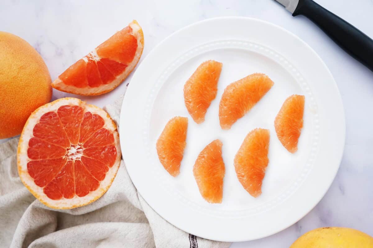 Segments of grapefruit on a plate