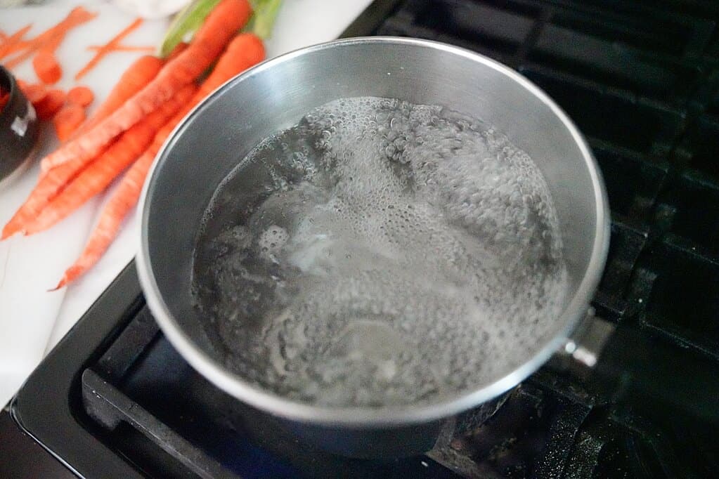 boiling water in a pot on stove
