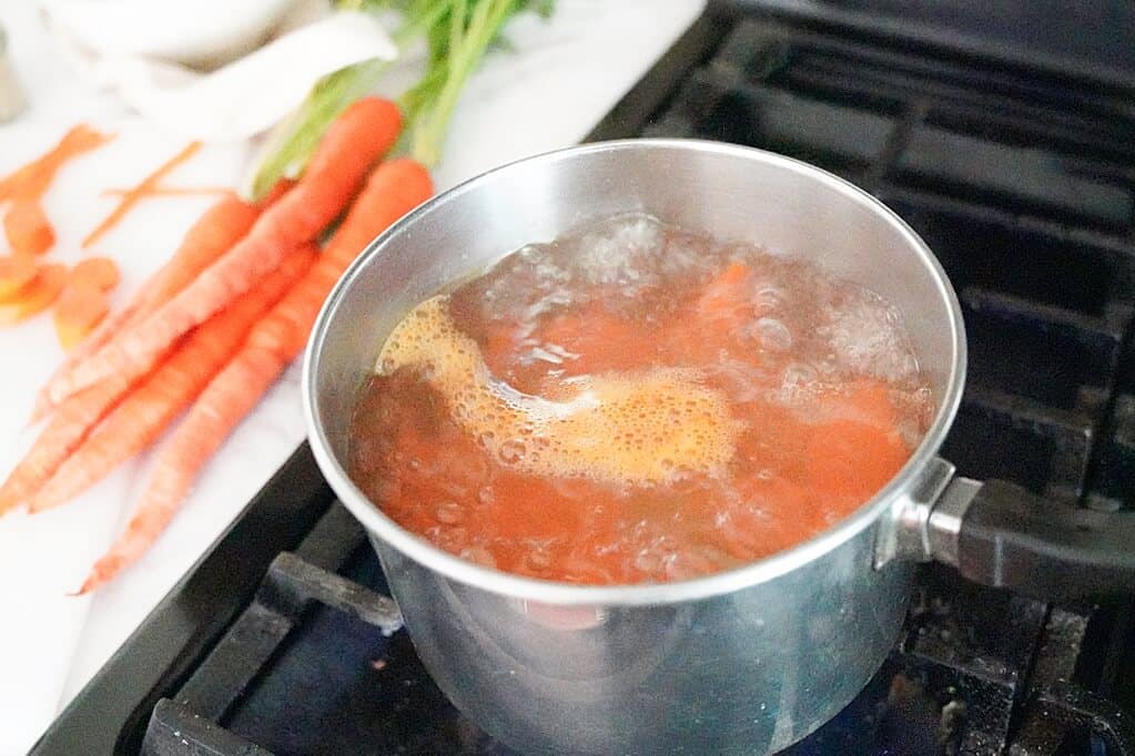 cut carrots in boiled water