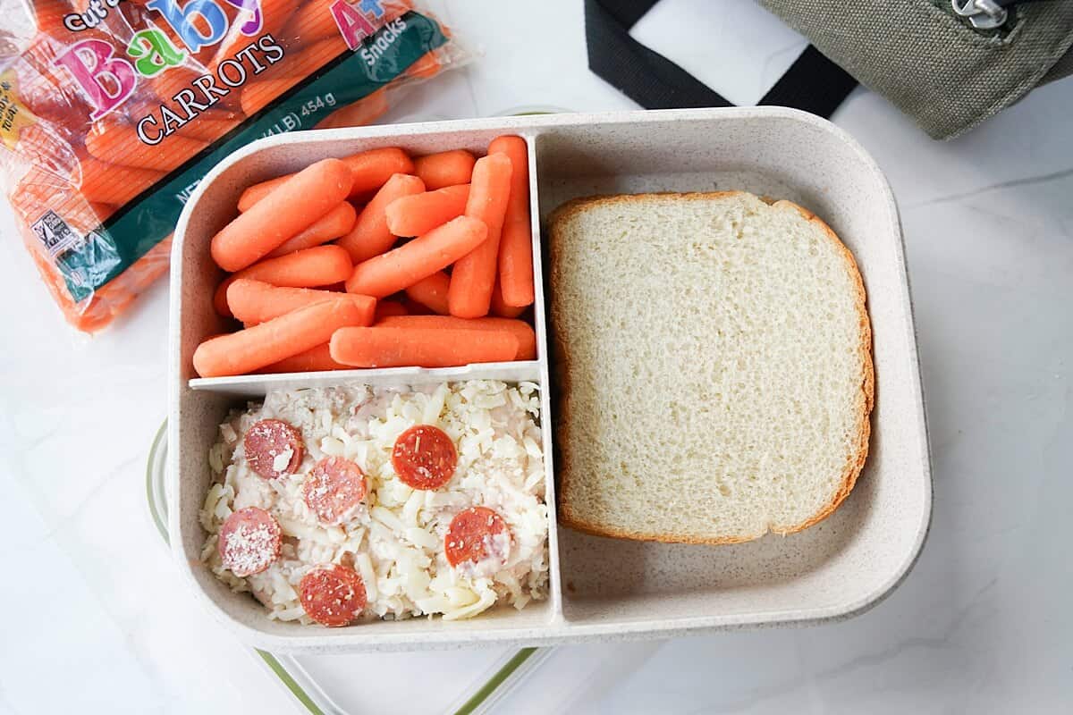 Ranch Pizza Dip in bento box with carrots and sandwich