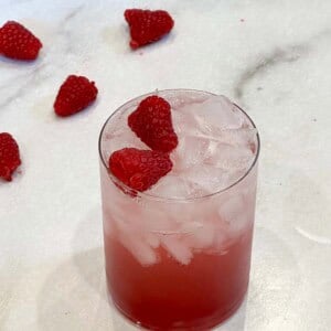 Vertical image of raspberry soda on counter
