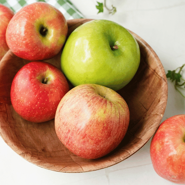 a bwol with a variety of apples
