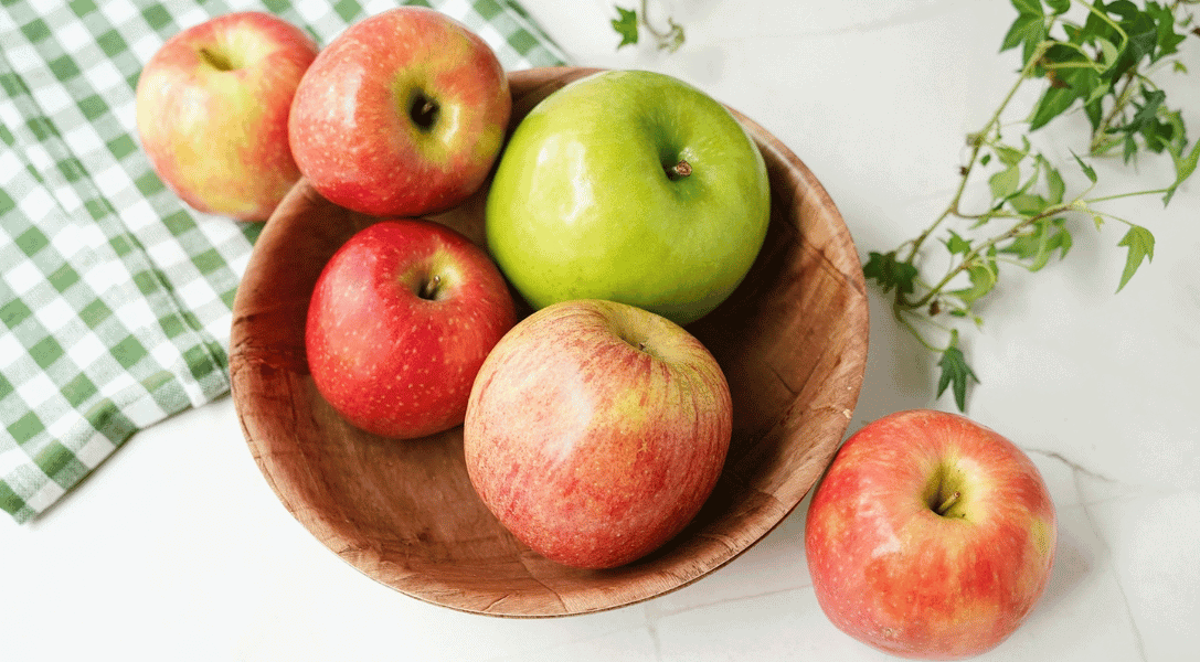 a bwol with a variety of apples