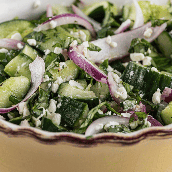 Smashed Cucumber Salad In a yellow bowl