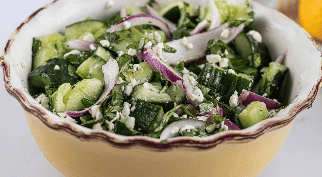 Smashed Cucumber Salad In a yellow bowl