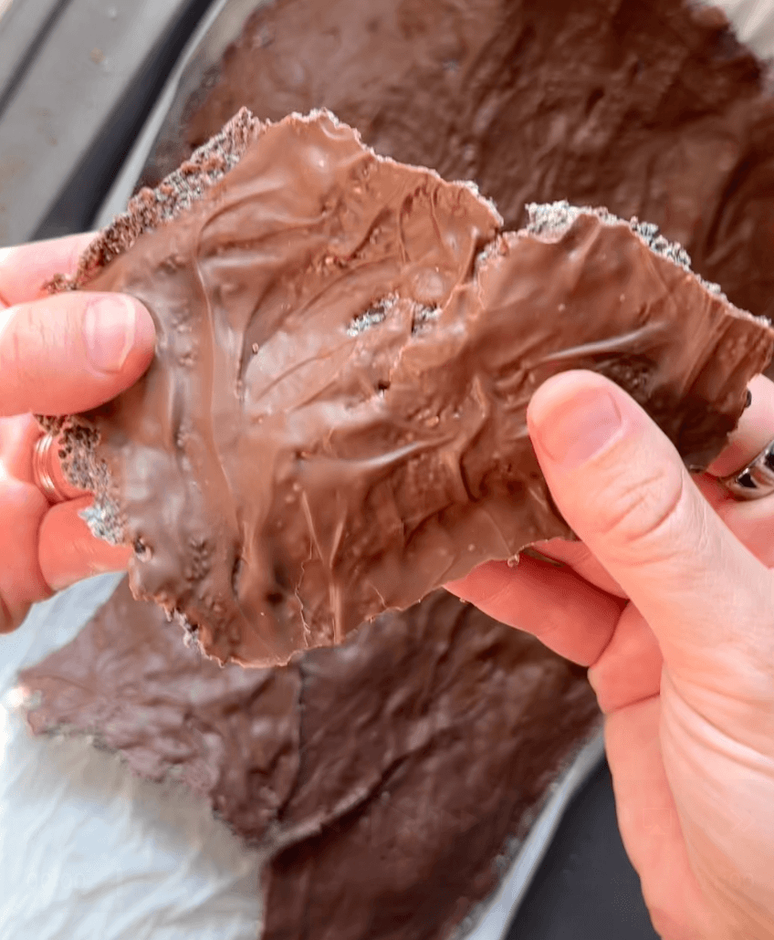Breaking chia seed chocolate crackers