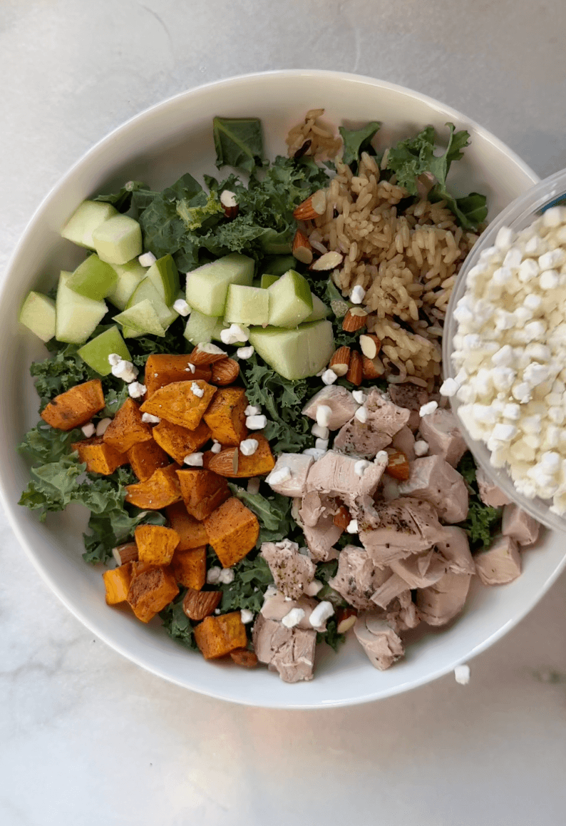 Adding cheese to Sweetgreen Harvest Salad