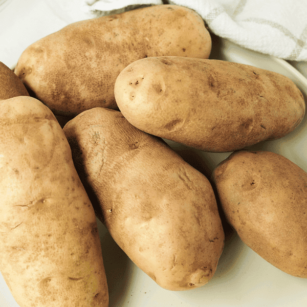 Ruesset potatoes on a white plate