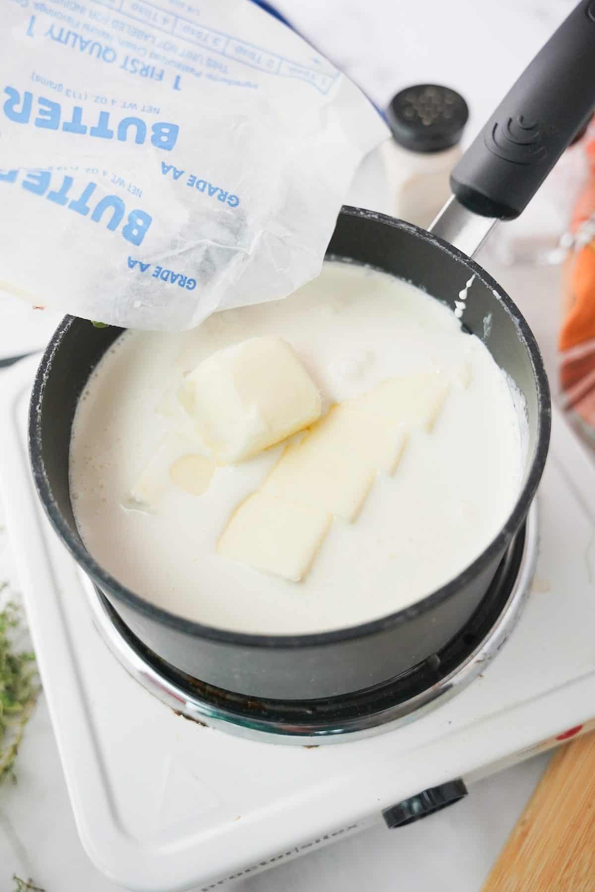 Butter and cream in a saucepan.